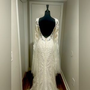 Lillian West #style 66274 Lace dress with plunging neckline with bell sleeves